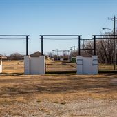 Gates or White Structure on N 97th E Ave