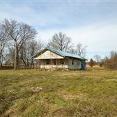 Blue Tarp Abandoned Home