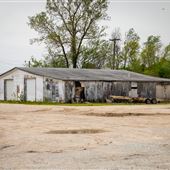 Old White Garage E 110 Rd Intersection